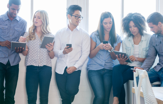 Several people using mobile devices